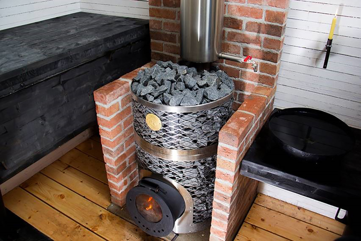 Is it safe to use a wood sauna stove indoors?